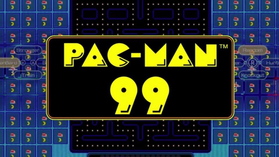 A photo of the title screen of Pac Man 99 with the title in bright yellow against a black and blue backdrop