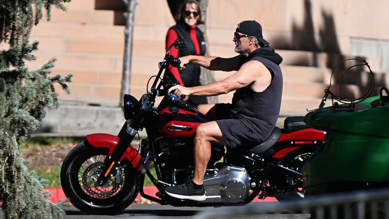 Utah head coach Kyle Whittingham arrives on a Harley-Davidson motorcycle as he appears on the Pat McAfee Show at the University of Utah on Friday, Oct. 27, 2023.