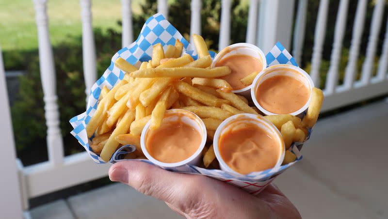 Ron Taylor holds Arctic Circle fries and fry sauce at his home in Orem on June 16, 2022. Fry sauce is once of the things that makes Utah unique.