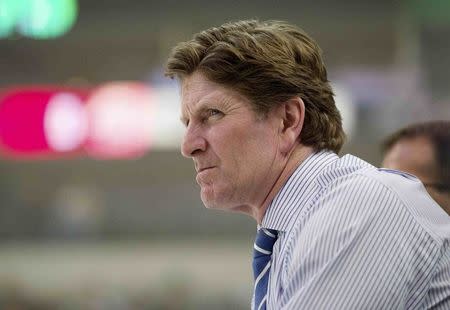 Detroit Red Wings head coach Mike Babcock watches his team warm up prior to the game between the Dallas Stars and the Red Wings in Dallas, Texas, in this file photo taken February 21, 2015. Mandatory Credit: Jerome Miron-USA TODAY Sports/Files