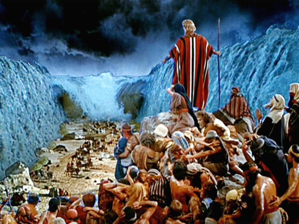 Charlton Heston as Moses while the Red Sea engulfs the Pharaoh's army.