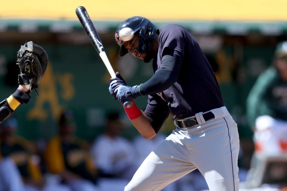 Guardians outfielder Oscar Mercado dodges a high pitch in the seventh inning of a 3-1 win over the Oakland Athletics on Saturday. [Jed Jacobsohn/Associated Press]