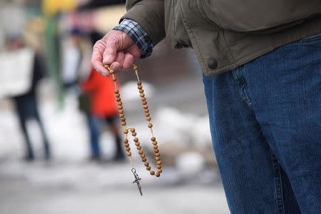 Anti-abortion activists say prayers and hold rosaries during a protest in front of Planned Parenthood, Far Northeast Surgical Center in Philadelphia, Pennsylvania, U.S., February 11, 2017. REUTERS/Charles Mostoller