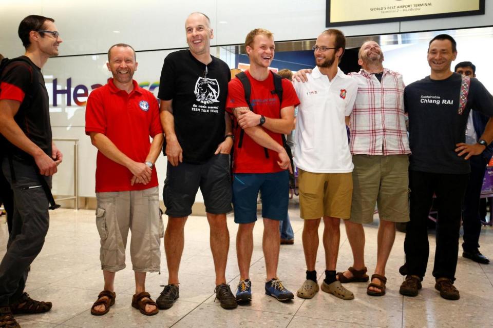 British cave divers, Rick Stanton, Chris Jewell, Connor Roe, Josh Bratchley, Jim Warny, Mike Clayton and Gary Mitchell, arrive back at Heathrow Airport (REUTERS)