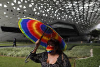 LGBT activist and human rights defender Marsha Beya Rubyn, 55, arrives for a movie showing at the Cineteca Nacional, Mexico's film archive, in Mexico City, Wednesday, Aug. 12, 2020. After being closed for nearly five months amidst the ongoing coronavirus pandemic, movie theaters in the capital reopened Wednesday at 30% capacity. (AP Photo/Rebecca Blackwell)