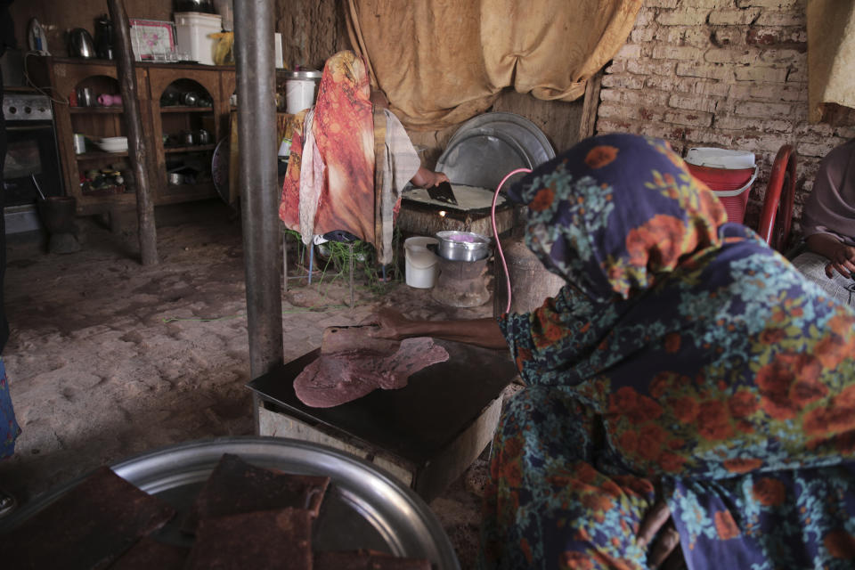 Sudanese women prepare Helo Murr, a Ramadan drink made with dried corn and spices which is then dipped in water, in Khartoum, Sudan, Wednesday, March. 22, 2023, ahead of the Muslim holy fasting month of Ramadan. (AP Photo/Marwan Ali)