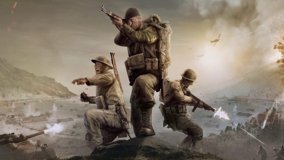  Company of Heroes 3 key art - three Allied soldiers on a rocky peak, shooting and throwing grenades at enemies. 