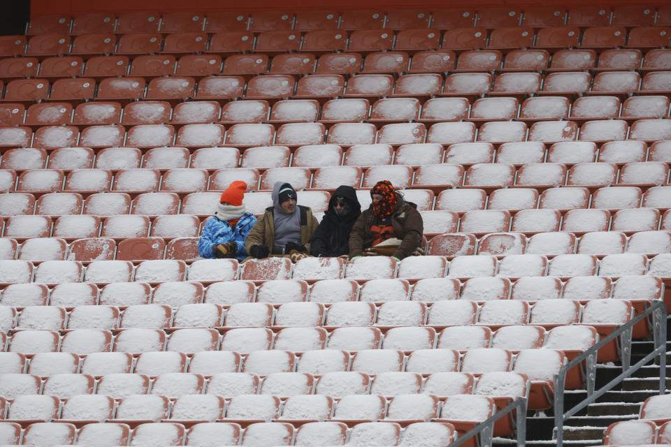 Football fans watch pregame warmups before an NFL football game between the Cleveland Browns and the New Orleans Saints, Saturday, Dec. 24, 2022, in Cleveland. (AP Photo/Ron Schwane)