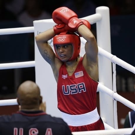 Quanitta Underwood of the United States, reacts after her fight against Natasha Jonas of Great Britain, during the women's lightweight boxing competition at the 2012 Summer Olympics, Sunday, Aug. 5, 2012, in London. (AP Photo/Patrick Semansky)