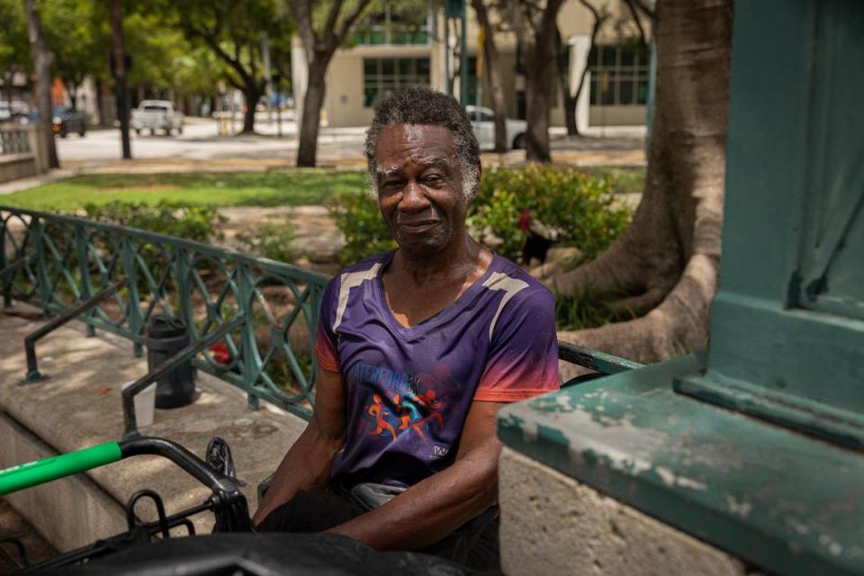 Ishmael Burch Jr., relaxes in the shade during the heat of the day on Monday, July 17, 2023, at the park across from Government Center in downtown Miami. Burch said he finds it hard to stay hydrated but that he can fill up his water bottle at the library nearby.