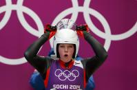 Austria's Miriam Kastlunger adjusts her helmet at the women's singles luge training session at the Sochi 2014 Winter Olympic Games at the Sanki Sliding Center February 8, 2014. REUTERS/Arnd Wiegmann (RUSSIA - Tags: SPORT LUGE OLYMPICS)