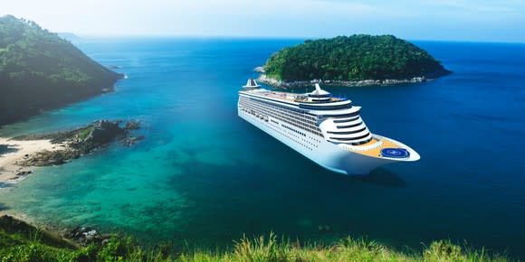 A cruise ship entering an isolated tropical bay