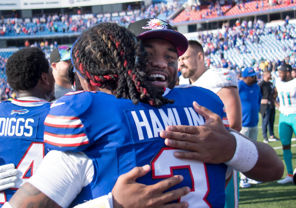 Buffalo Bills safety Damar Hamlin (3) gets a hug from Miami Dolphins quarterback Tua Tagovailoa after a game in October. (Photo: Mark Konezny-USA TODAY Sports)