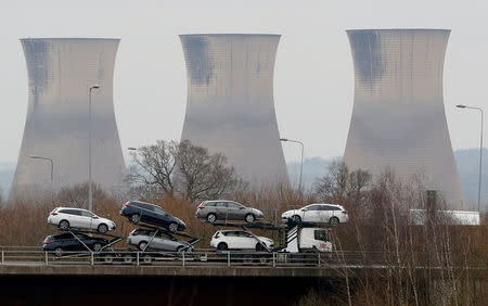 FILE PHOTO: New Toyota cars are transported from their manufacturing facility in Burnaston, Britain March 16, 2017. REUTERS/Darren Staples/File Photo