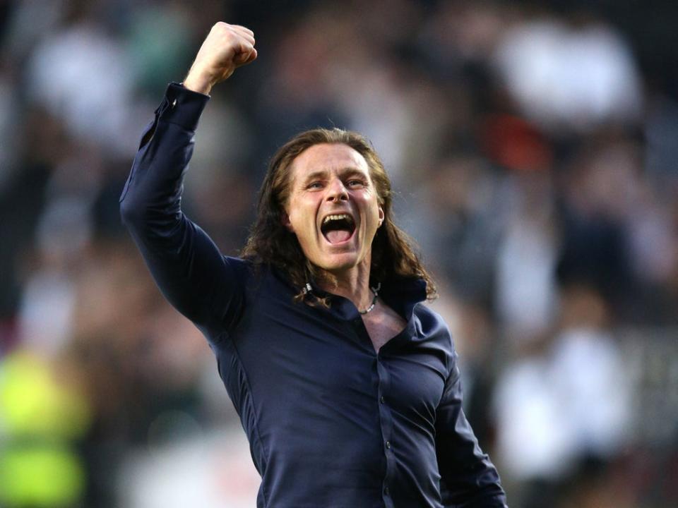 Wycombe manager Gareth Ainsworth celebrates beating MK Dons in the semi-finals (PA)
