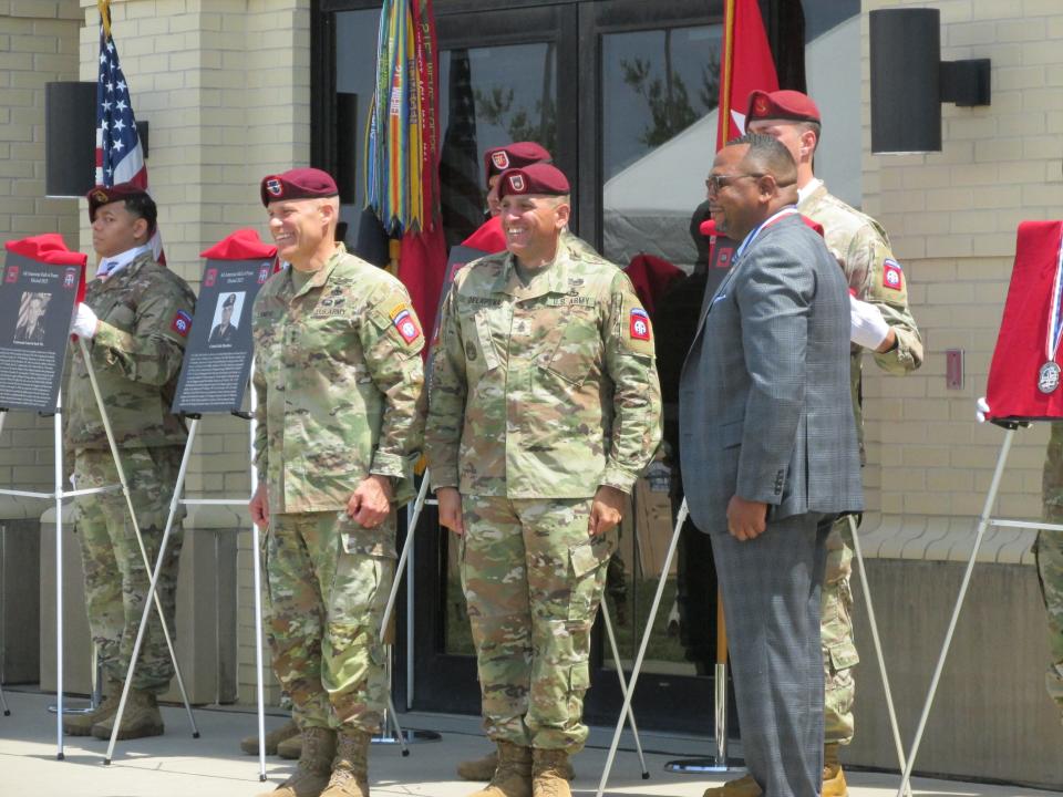 Retired Command Sgt. Maj. Steven Payton, far right, is congratulated by  Maj. Gen. Christopher LaNeve, far left and Command Sgt. Maj. Randolph Delapena, second from right, after being inducted into the 82nd Airborne Division Hall of Fame during a ceremony Wednesday, May 24, 2023, at Fort Bragg.