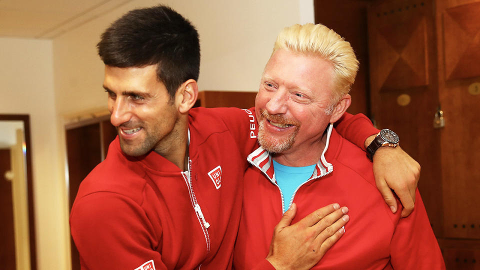 Boris Becker (pictured right) celebrating and sharing a hug with Novak Djokovic (pictured left).