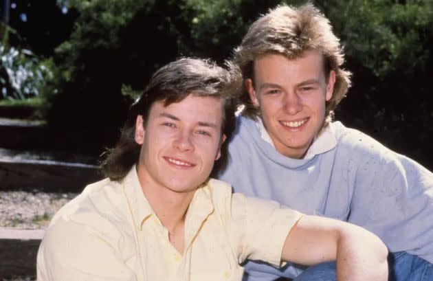 Guy with his Neighbours co-star Jason Donovan (Scott Robinson) back in the day (Photo: Fremantle Media/Shutterstock)