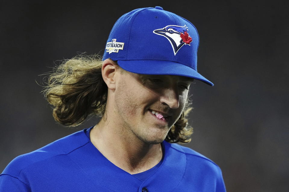 Toronto Blue Jays starting pitcher Kevin Gausman smiles after being taken out during the sixth inning of Game 2 of a baseball AL wild-card playoff series against the Seattle Mariners, Saturday, Oct. 8, 2022, in Toronto. (Nathan Denette/The Canadian Press via AP)