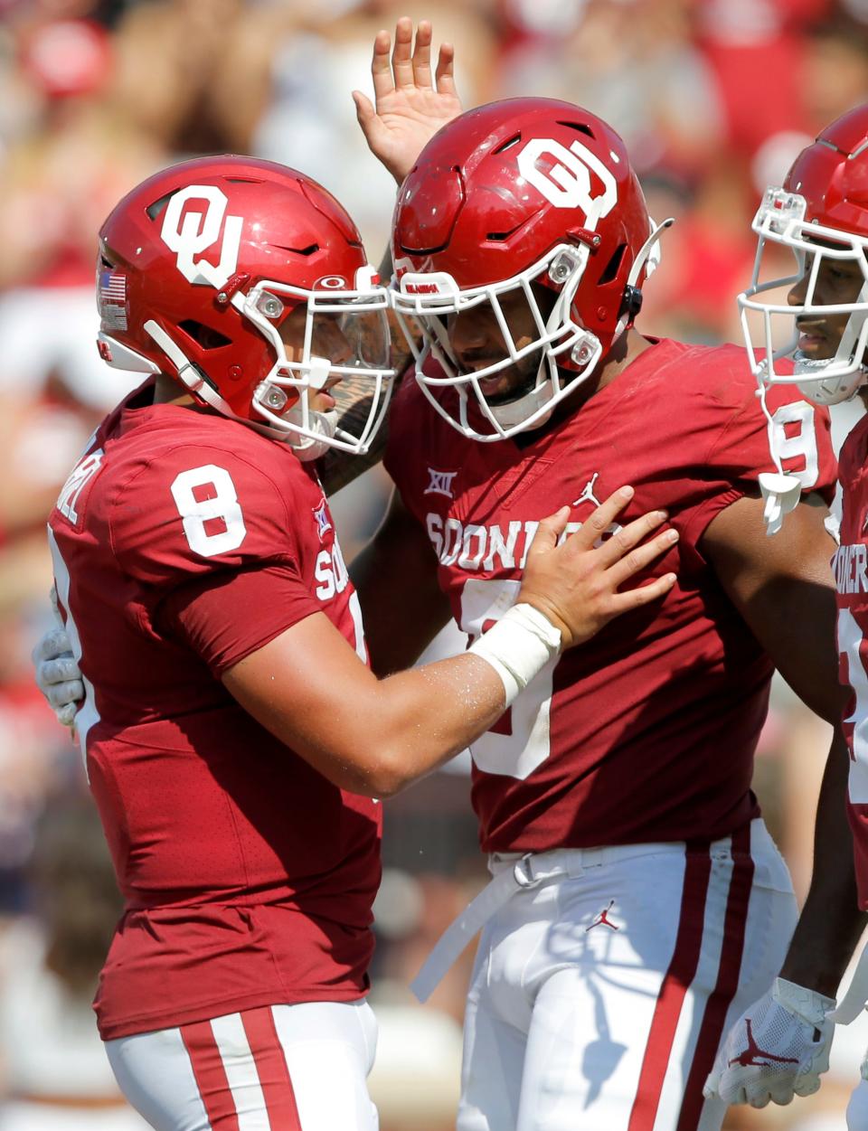 OU quarterback Dillon Gabriel (8) celebrates a touchdown pass with tight end Brayden Willis (9) during Saturday's 45-13 win over UTEP in Norman.