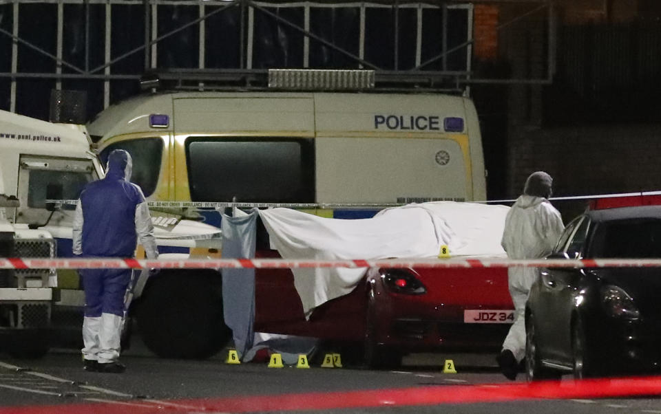 Forensic officers attending the scene of a suspected shooting in West Belfast Glen Road close to St Mary’s Grammar School, West Belfast. (Liam McBurney/PA)