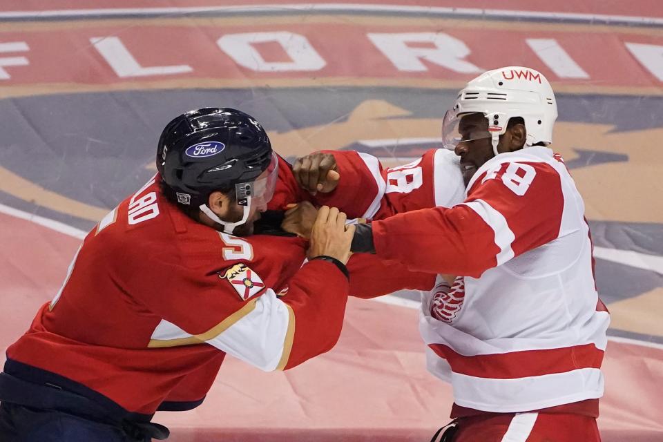 Florida Panthers defenseman Aaron Ekblad, left, and Detroit Red Wings right wing Givani Smith fight during the third period Sunday, Feb. 7, 2021, in Sunrise, Fla.