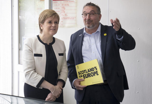 First Minister Nicola Sturgeon with SNP European election candidate Christian Allard during a visit to J Charles Ltd seafood processing plant in Aberdeen. Christian Allard worked at J Charles Ltd for 25 years exporting seafood to the continent, before he entered politics.