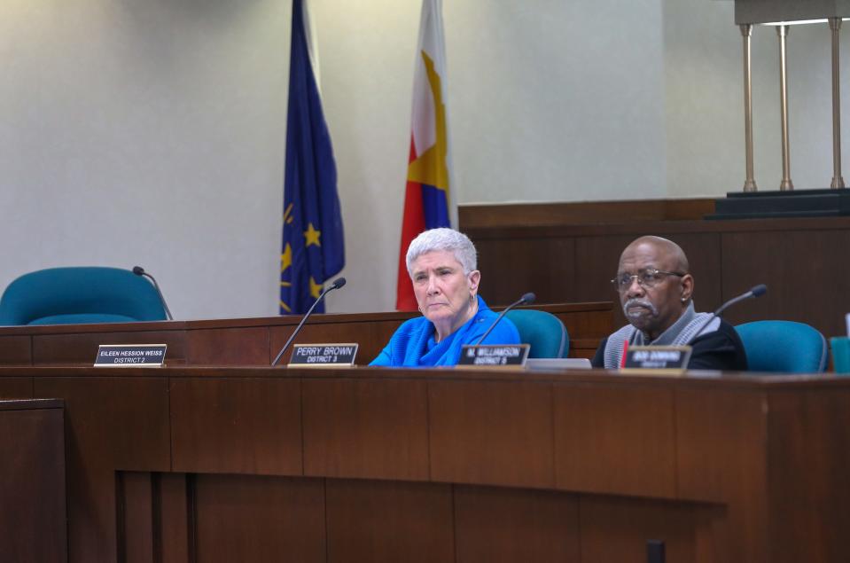 Eileen Hession Weiss, Lafayette City Councilwoman, and Perry E. Brown, Lafayette City Councilman, listen to Chris Wischer, the attorney for the Town of Dayton explain why the board should vote no on the voluntary annexation of the Carr family property into the City of Lafayette, at May's Lafayette City Council meeting, on Monday, May 1, 2023, in Lafayette, Ind.