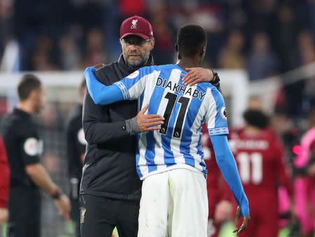 Soccer Football - Premier League - Huddersfield Town v Liverpool - John Smith's Stadium, Huddersfield, Britain - October 20, 2018 Liverpool manager Juergen Klopp with Huddersfield Town's Adama Diakhaby after the match REUTERS/Hannah McKay