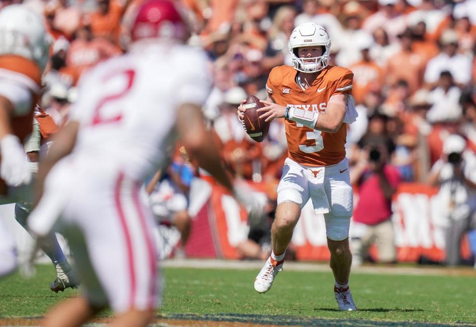 Texas Longhorns quarterback Quinn Ewers (3) looks for room to run against <a class="link " href="https://sports.yahoo.com/ncaaf/teams/oklahoma/" data-i13n="sec:content-canvas;subsec:anchor_text;elm:context_link" data-ylk="slk:Oklahoma Sooners;sec:content-canvas;subsec:anchor_text;elm:context_link;itc:0">Oklahoma Sooners</a> defense in the third quarter during an NCAA college football game at the Cotton Bowl on Saturday, Oct. 7, 2023 in Dallas, <a class="link " href="https://sports.yahoo.com/ncaaf/teams/texas/" data-i13n="sec:content-canvas;subsec:anchor_text;elm:context_link" data-ylk="slk:Texas;sec:content-canvas;subsec:anchor_text;elm:context_link;itc:0">Texas</a>. This game makes up the119th rivalry match up.