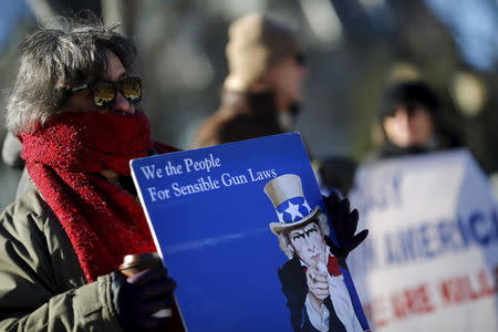 Gun control activists rally in front of the White House in Washington, January 4, 2016. REUTERS/Carlos Barria