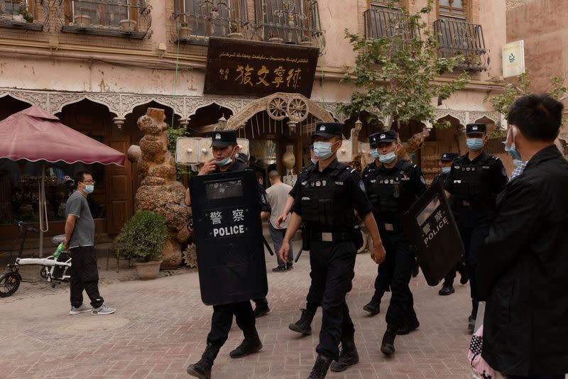 FILE PHOTO: In China's new Xinjiang: patriotic tourism, police and propaganda