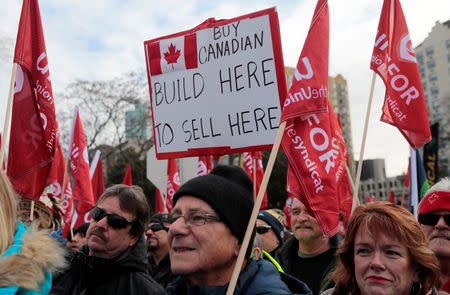 General Motors assembly workers and supporters protest GM's announcement to close its Oshawa assembly plant during a Unifor union rally across the Detroit River from GM's headquarters, in Windsor, Ontario, Canada January 11, 2019. REUTERS/Rebecca Cook