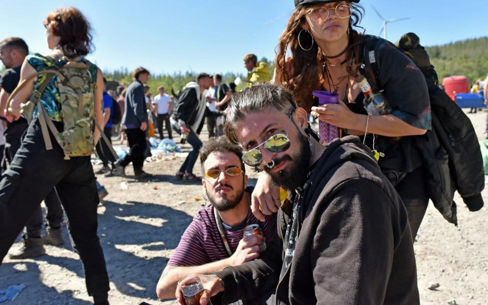 Rave which started in the early hours of Sunday in the forest at Neath Port Talbot, near the village of Banwen. Posing for a picture. - Richard Swingler