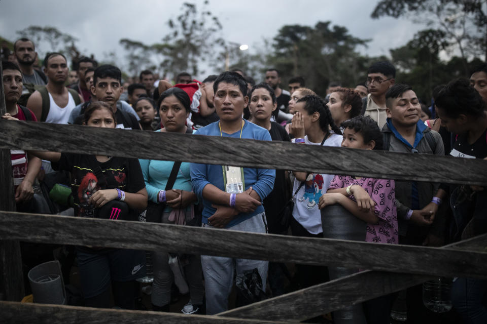 Migrants planning to start walking across the Darien Gap from Colombia to Panama in hopes of reaching the U.S. gather at the trailhead camp in Acandi, Colombia, Tuesday, May 9, 2023. The image was part of a series by Associated Press photographers Ivan Valencia, Eduardo Verdugo, Felix Marquez, Marco Ugarte Fernando Llano, Eric Gay, Gregory Bull and Christian Chavez that won the 2024 Pulitzer Prize for feature photography. (AP Photo/Ivan Valencia)