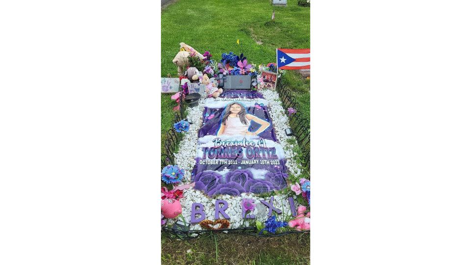 Brexi's image, stuffed animals and other decorations adorn her grave. - Courtesy Brenlee Ortiz