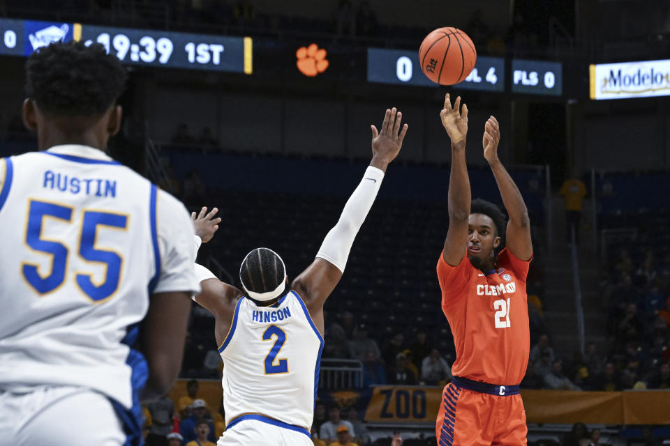 Clemson forward Chauncey Wiggins shoots over Pittsburgh forward Blake Hinson (2) during the second half of an NCAA college basketball game, Sunday, Dec. 3, 2023, in Pittsburgh, Pa. (AP Photo/Barry Reeger)