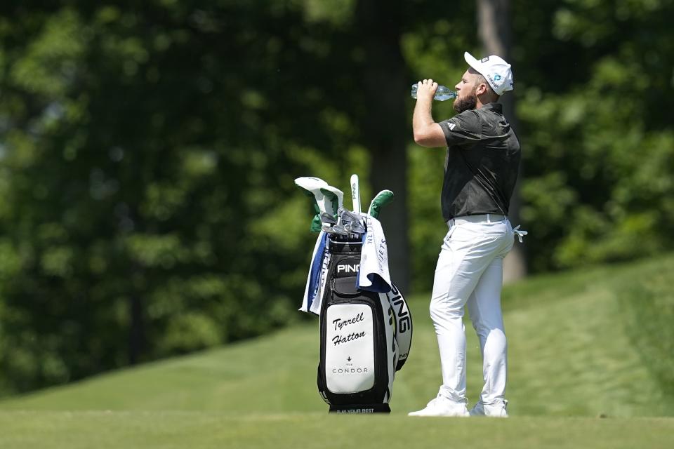 Tyrrell Hatton, of England, takes a drink of water on the ninth fairway during the first round of the Memorial golf tournament, Thursday, June 1, 2023, in Dublin, Ohio. (AP Photo/Darron Cummings)