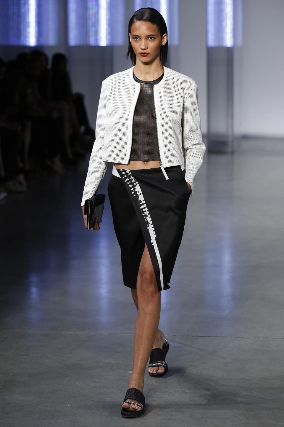 The Helmut Lang Spring 2014 collection is modeled during Fashion Week in New York, Friday, Sept. 6, 2013. (AP Photo/John Minchillo)