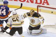 New York Islanders' Jean-Gabriel Pageau (44) scores a goal against Boston Bruins goalie Tuukka Rask (40), of Finland, during the third period of an NHL hockey game Monday, Jan. 18, 2021, in Uniondale, N.Y. (AP Photo/Jason DeCrow)