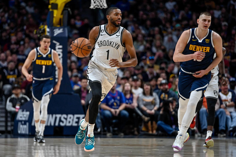 DENVER, CO - MARCH 12:  Mikal Bridges #1 of the Brooklyn Nets dribbles in the first half of a game against the Denver Nuggets at Ball Arena on March 12, 2023 in Denver, Colorado. NOTE TO USER: User expressly acknowledges and agrees that, by downloading and or using this photograph, User is consenting to the terms and conditions of the Getty Images License Agreement. (Photo by Dustin Bradford/Getty Images)