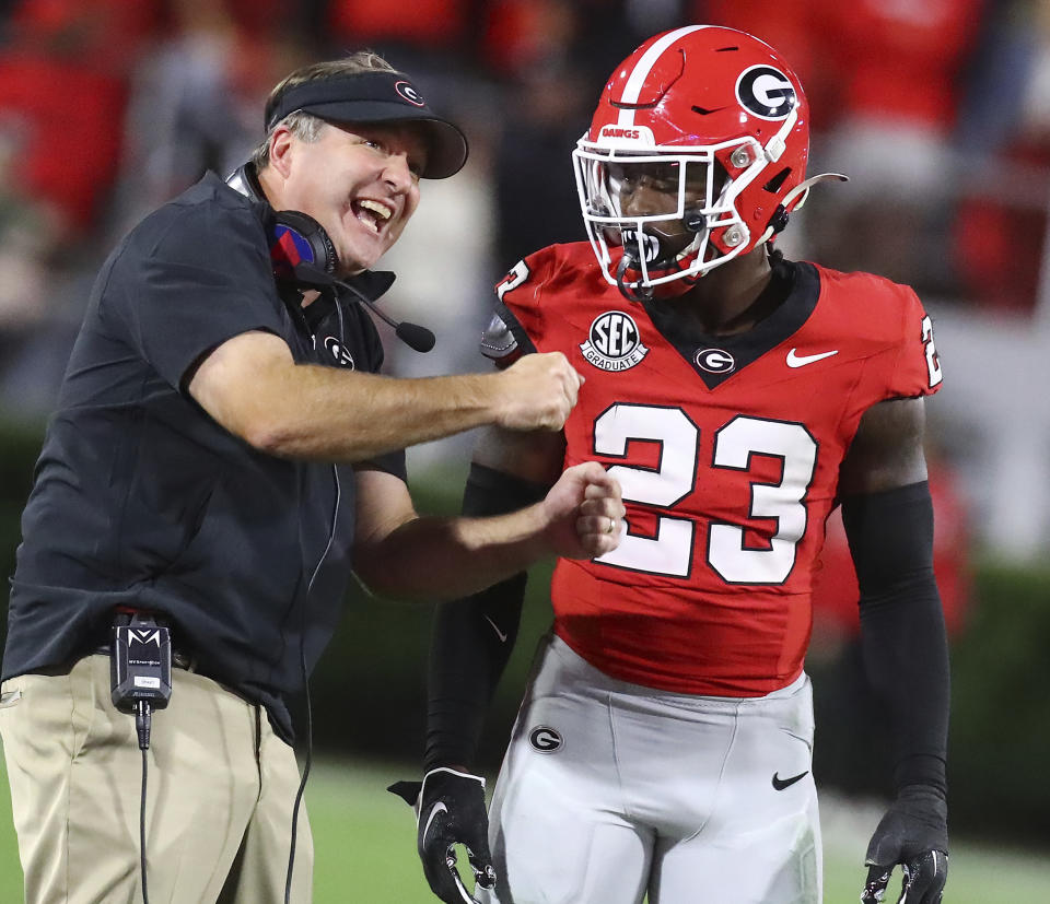 Georgia coach Kirby Smart talks to defensive back Tykee Smith during the second half of the team's NCAA college football game against Kentucky on Saturday, Oct. 7, 2023, in Athens, Ga. (Curtis Compton/Atlanta Journal-Constitution via AP)
