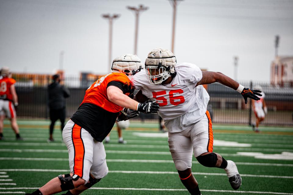 Oklahoma State redshirt senior Xavier Ross (56) has flourished in his move to defensive end.