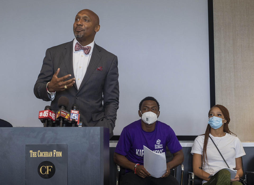 Charmaine Turner, right, and Secoriey Williamson, parents of Secoriea Turner, listen as attorney Mawuli Davis speaks during a press conference to announce a lawsuit against the city of Atlanta and others for a series of actions that resulted in the death of the 8-year-old, Monday, June 7, 2021. (Alyssa Pointer/Atlanta Journal-Constitution via AP)