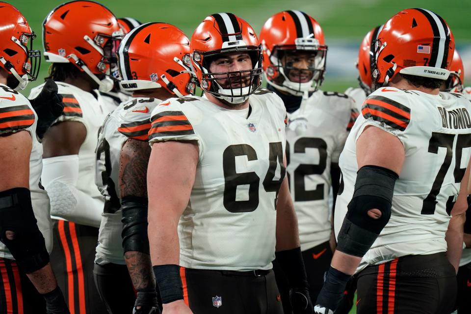 Browns center JC Tretter (64) missed his first game since joining the Browns last week with COVID but is feeling better and hopes to be cleared to play against the Pittsburgh Steelers on Monday night. [Seth Wenig/Associated Press file]