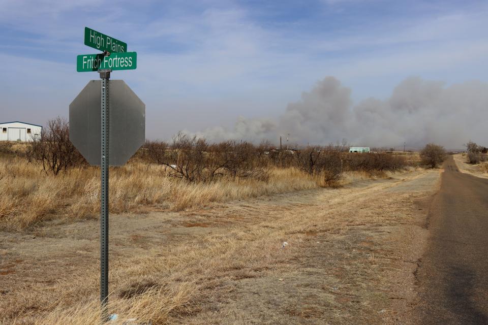 The Smokehouse Creek Fire near Stinnett, Texas, can be seen in the distance from the north end of Lake Meredith on Tuesday afternoon.