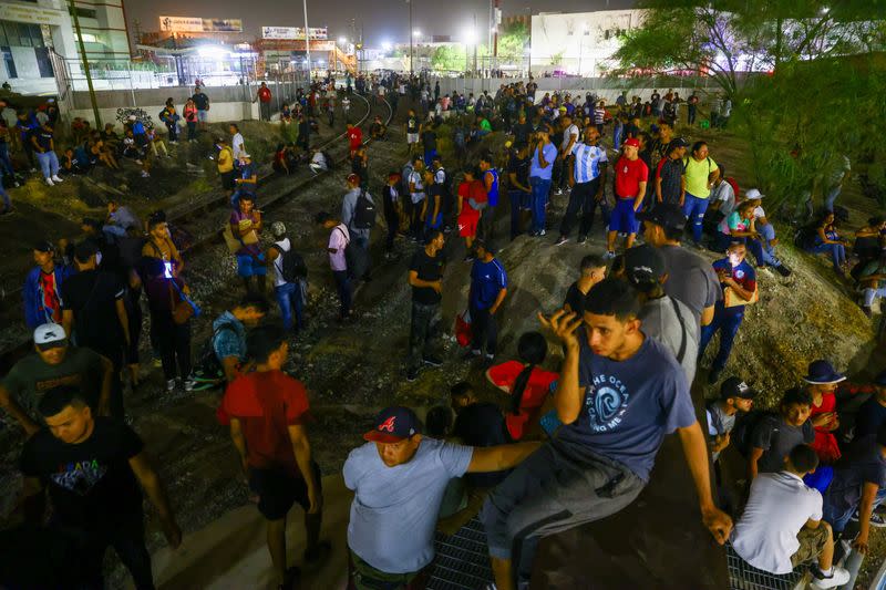 Migrants gather near the border to request asylum in the United States, in Ciudad Juarez