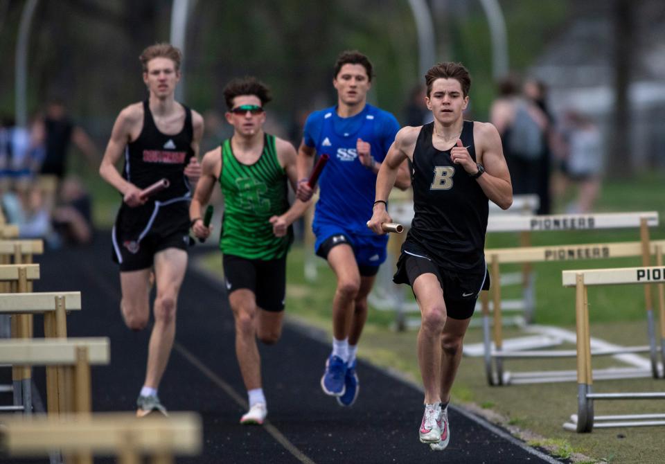 Boonville’s Eli Mayes leads in the 4x800 meter relay during a track meet in Boonville, Ind., Tuesday, April 9, 2024.