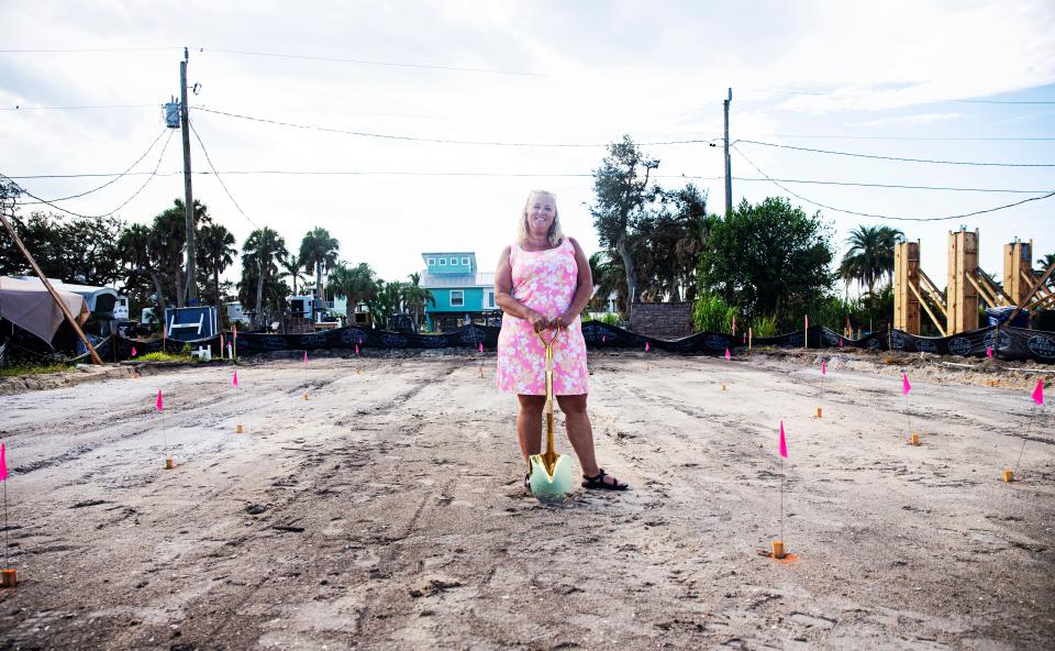 Debi Szekely stands for a portrait on her Fort Myers Beach property during a groundbreaking for her new home on Fort Myers Beach Friday, Sept. 8, 2023. Her home was destroyed in Hurricane Ian last year. Homebound is building a new home on the property.