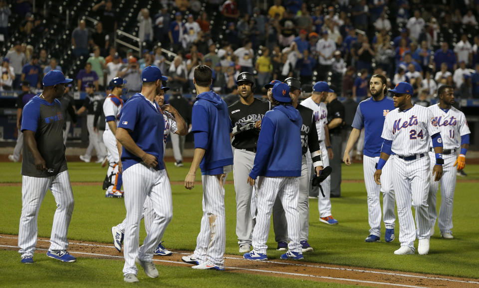 NEW YORK, NEW YORK - JUNE 07:   Ian Desmond #20 of the Colorado Rockies has words with members of the New York Mets after he was hit by a pitch during the eighth inning and the benches cleared at Citi Field on June 07, 2019 in New York City. (Photo by Jim McIsaac/Getty Images)